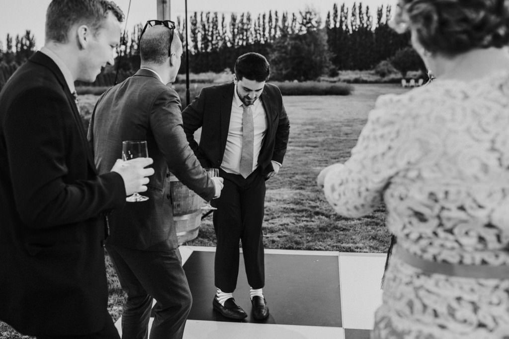 A guest shows off his dance moves at Zoe and Daniel's wedding reception at Zoe and Daniel toast to their guests at their wedding reception at Zoe tears up as her dad gives a toast at hers and Daniels' wedding reception at Champagne and guests at the Woodinville Lavender Farm, Washington, Summer 2016
