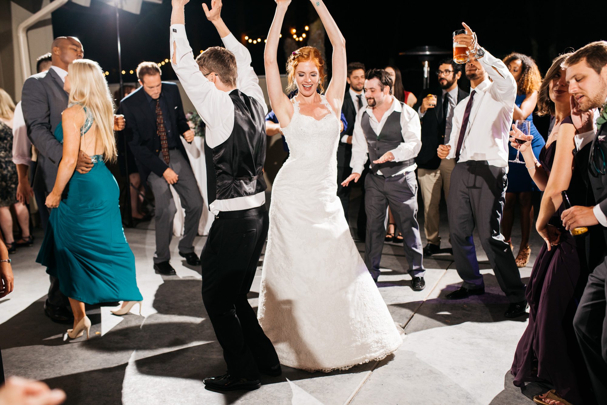 Guests celebrating and dancing at Katherine and Graeme's wedding reception at Kingston House, WA.