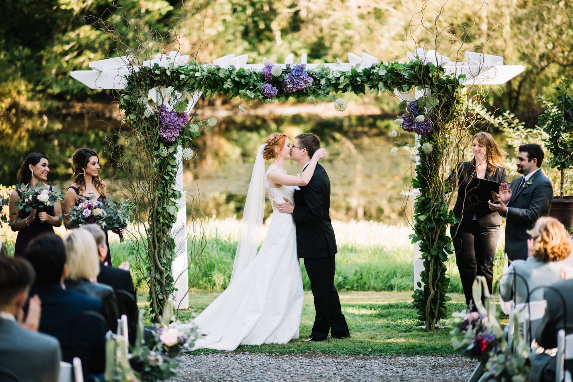 Katherine and Graeme share their first kiss as husband and wife at their Kingston House wedding.