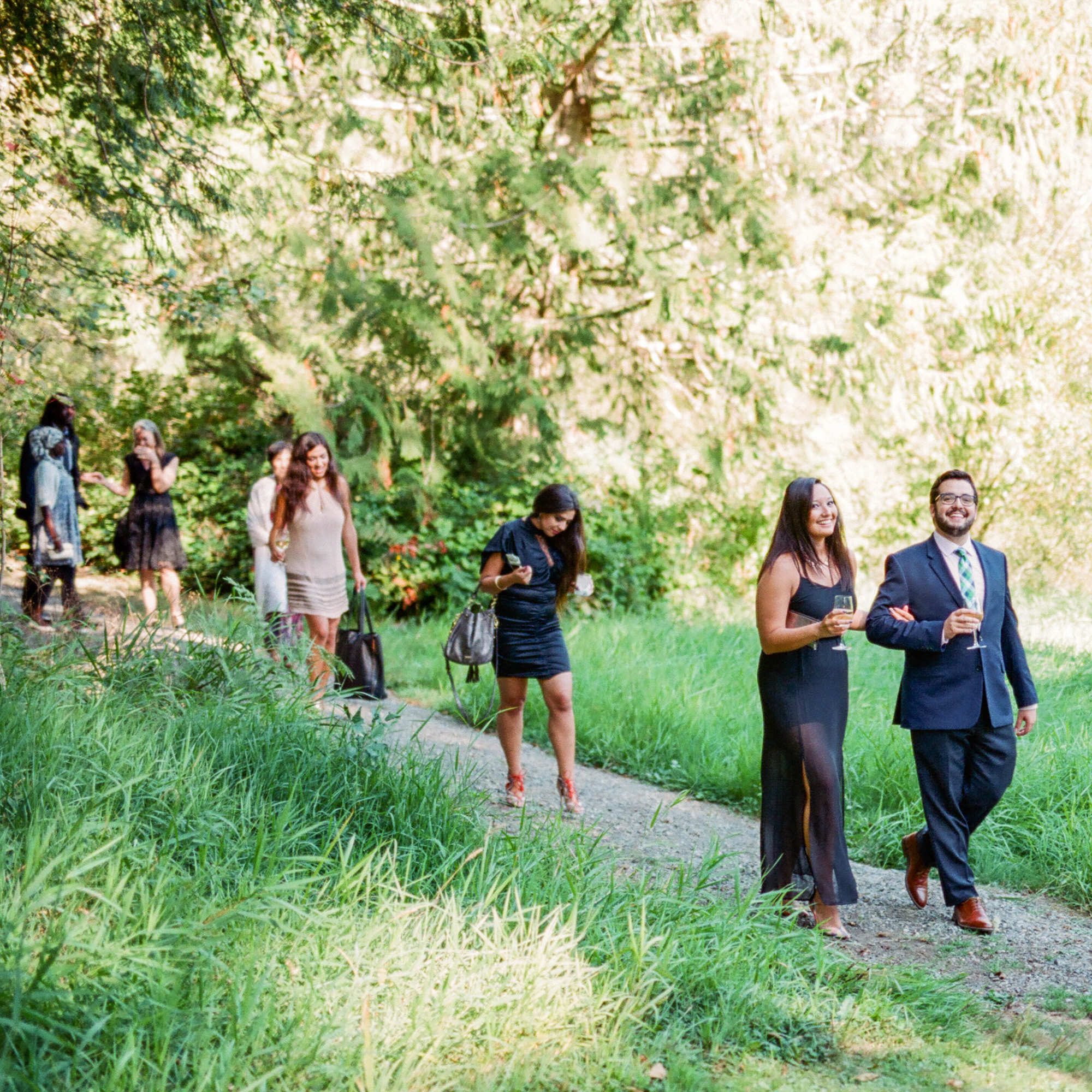 Guests walking over to the wedding ceremony at Kingston House, WA. September 2016.