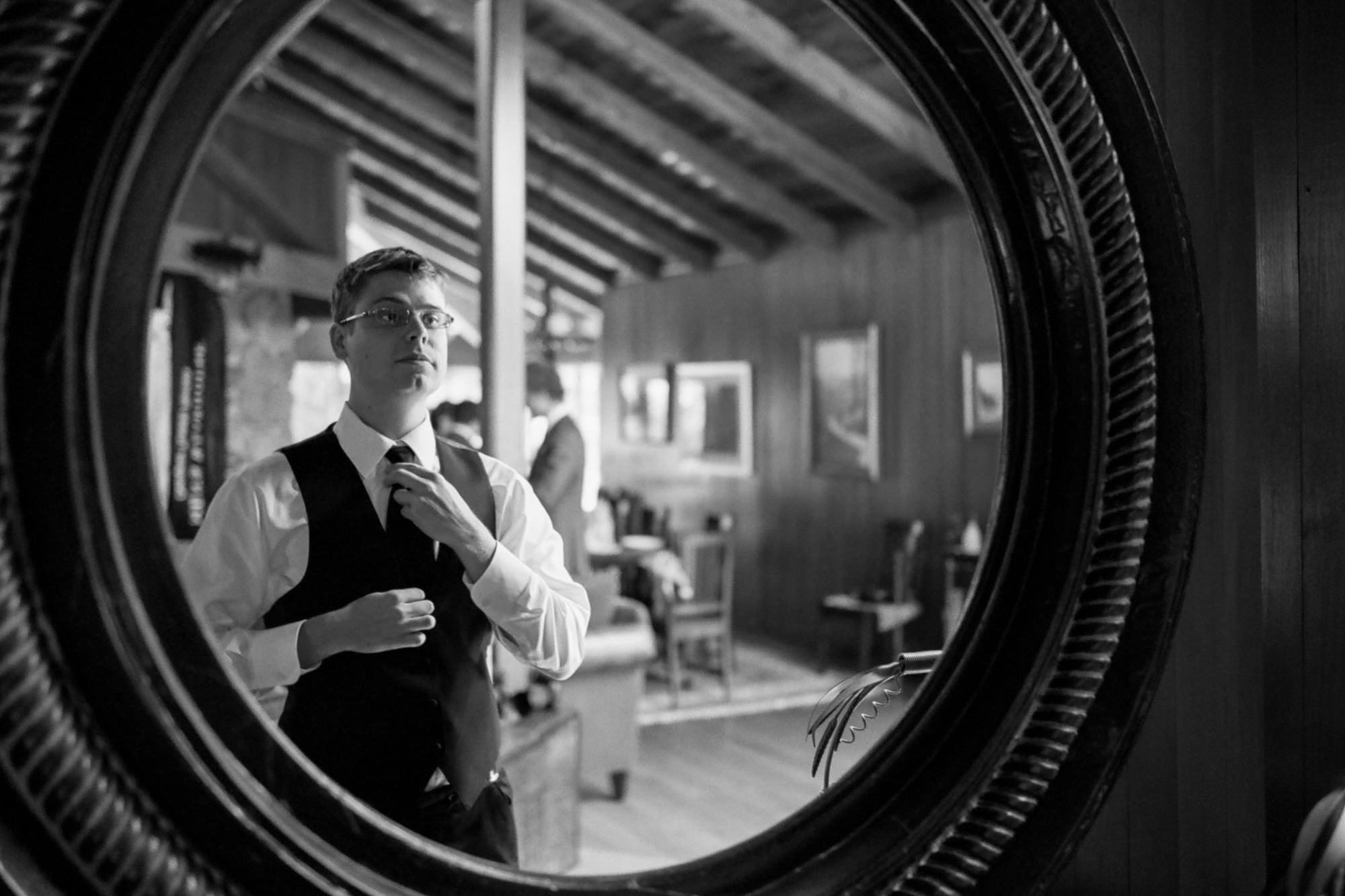 Graeme, the groom, gets ready with his groomsmen at Kingston House, a wedding venue in Kingston, Washington.
