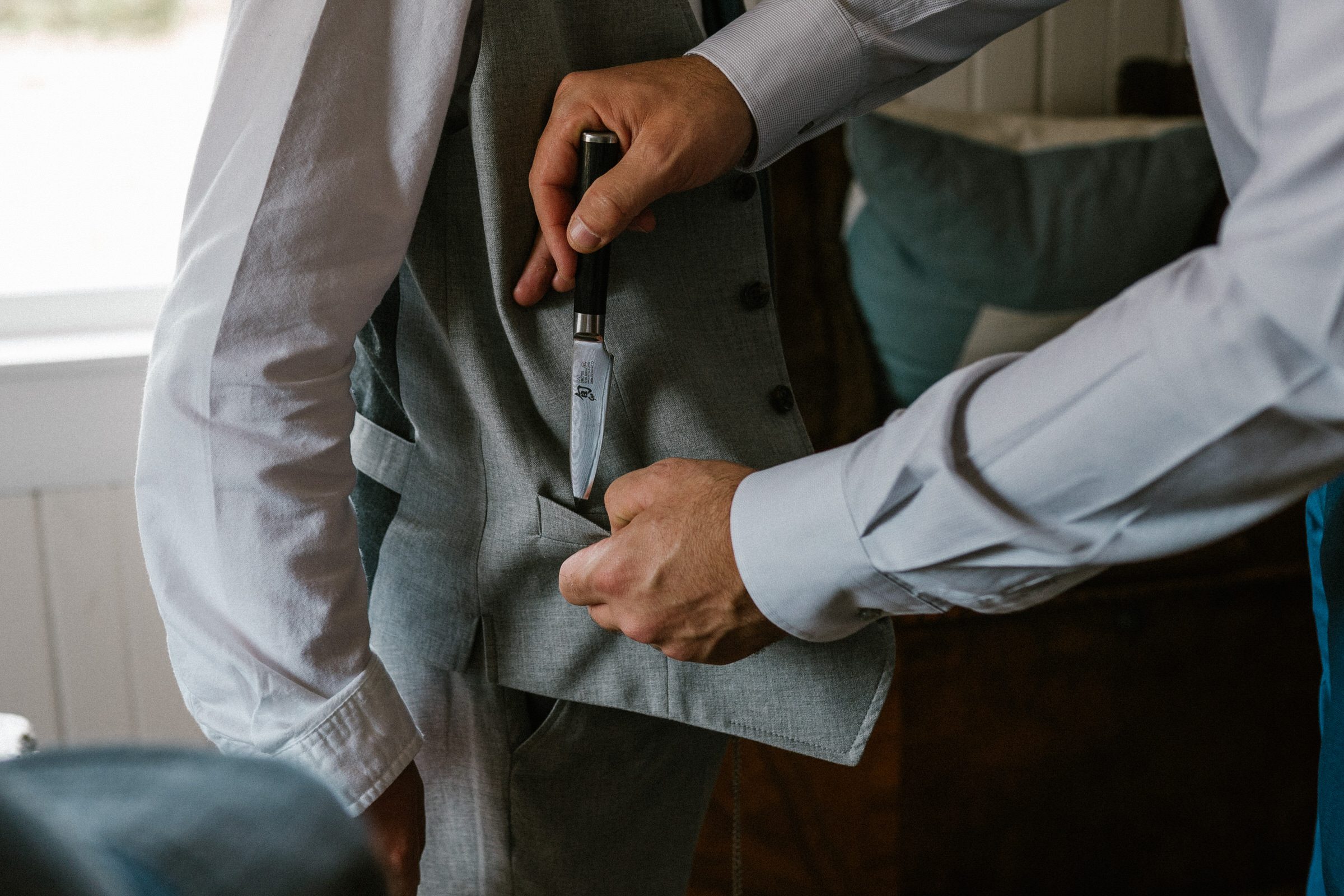 Wayfarer Whidbey Island Wedding: Funny candid of the groom and his sons getting ready.