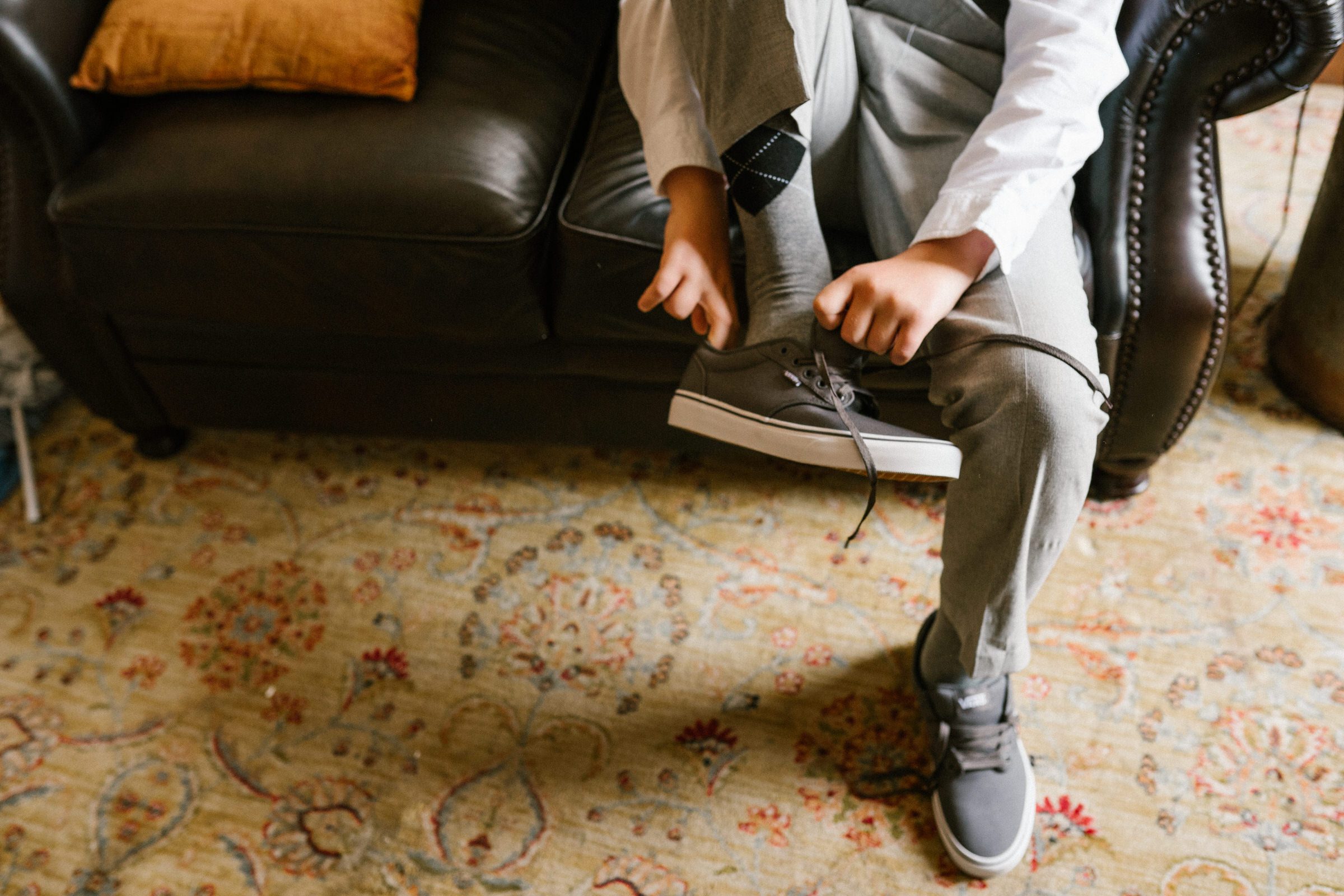 Wayfarer Whidbey Island Wedding: Funny candid of the groom and his sons getting ready.
