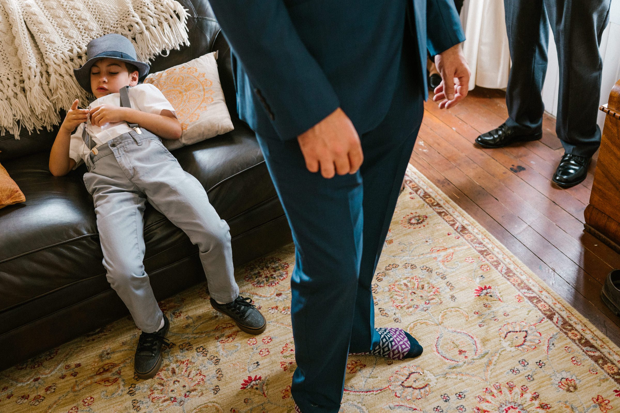 Wayfarer Whidbey Island Wedding: Funny candid of the groom and his sons getting ready.