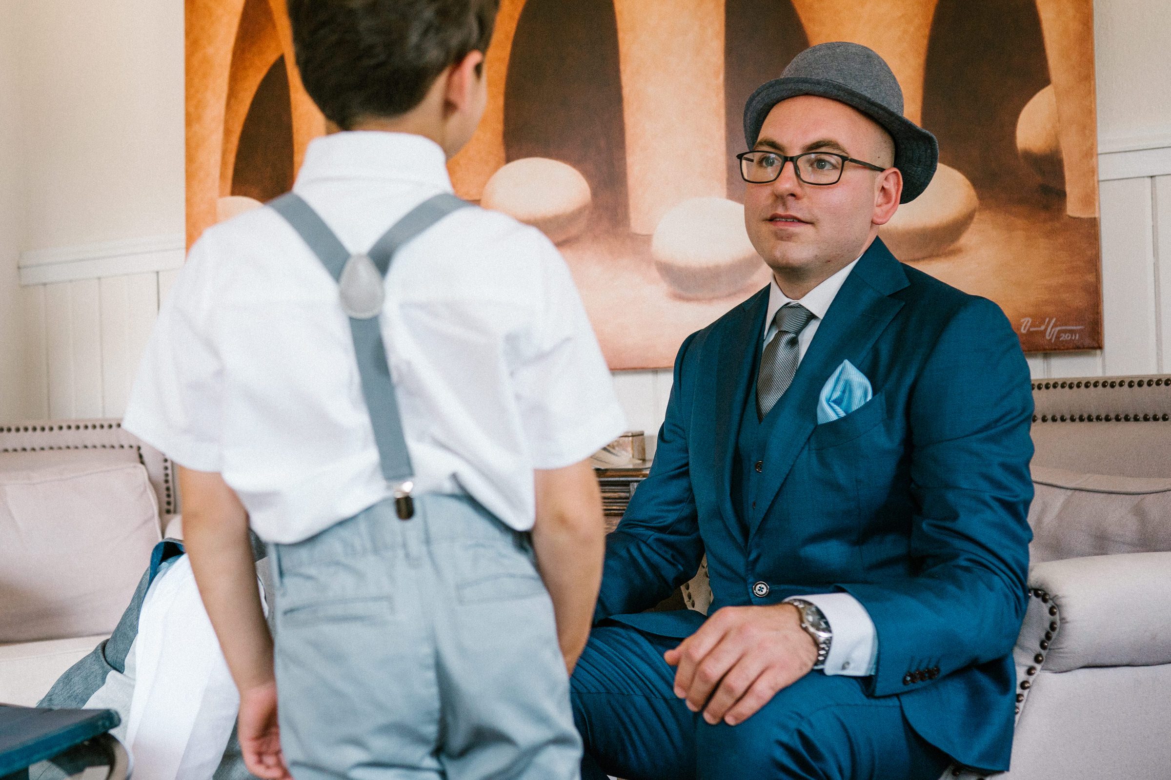 Wayfarer Whidbey Island Wedding: Funny candid of the groom and his sons getting ready.