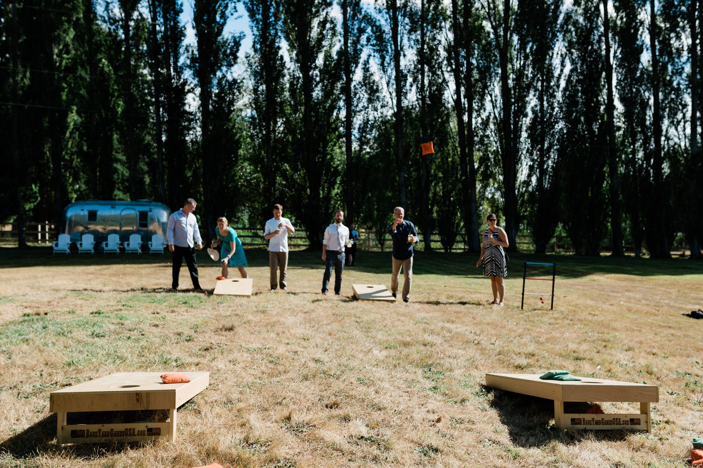 Wayfarer Whidbey Island Wedding: Bean bag toss lawn game at a wedding