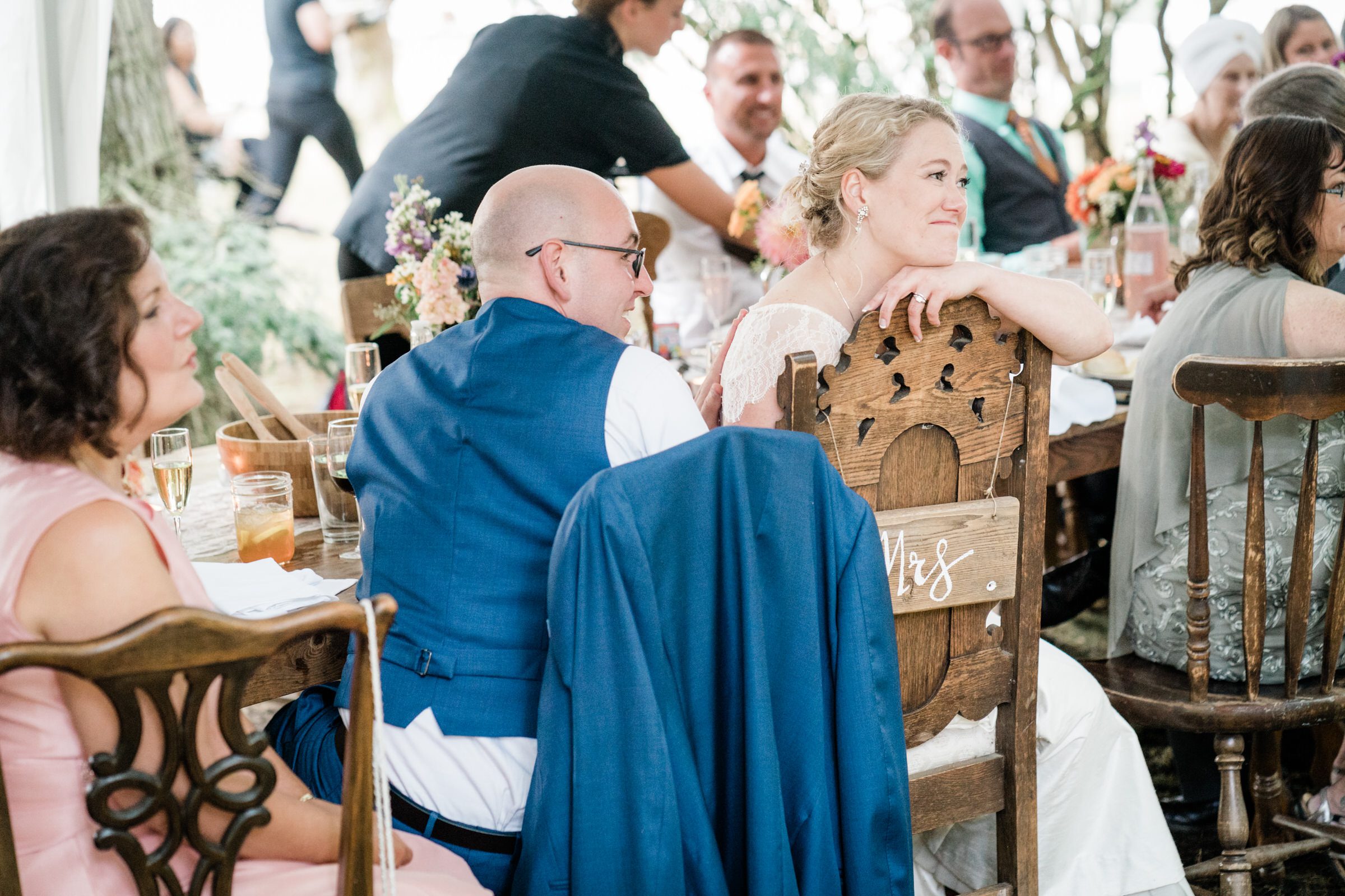 Wayfarer Whidbey Island Wedding: Sara and Joe watch as Joe's son gives them a toast
