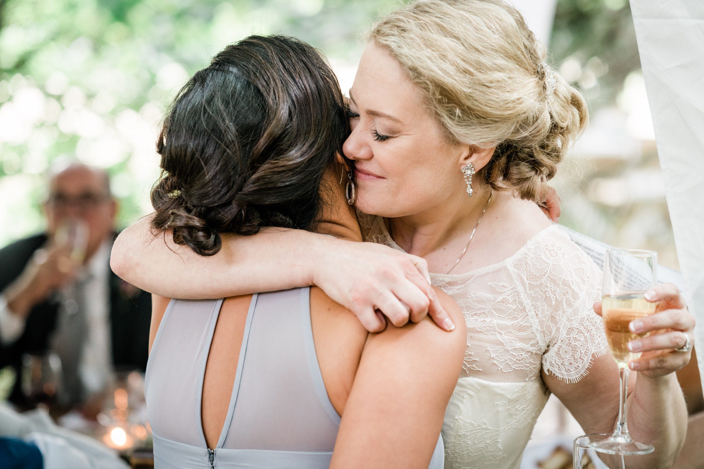 Wayfarer Whidbey Island Wedding: Bride Sara embraces her maid of honor Sylvia after her heartfelt toast