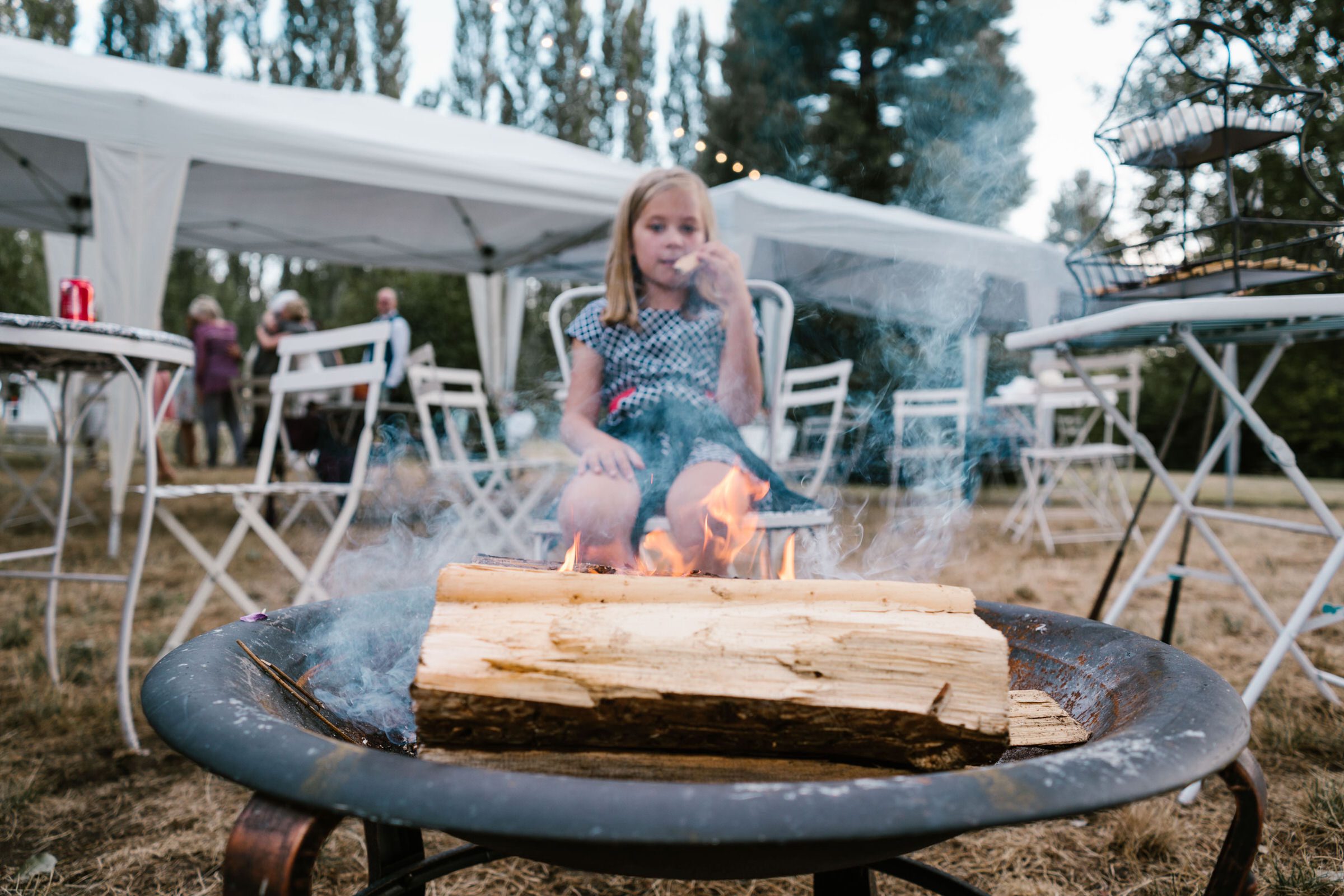 Wayfarer Whidbey Island Wedding: Sara and Joe's little guest roasting smores at their wedding reception
