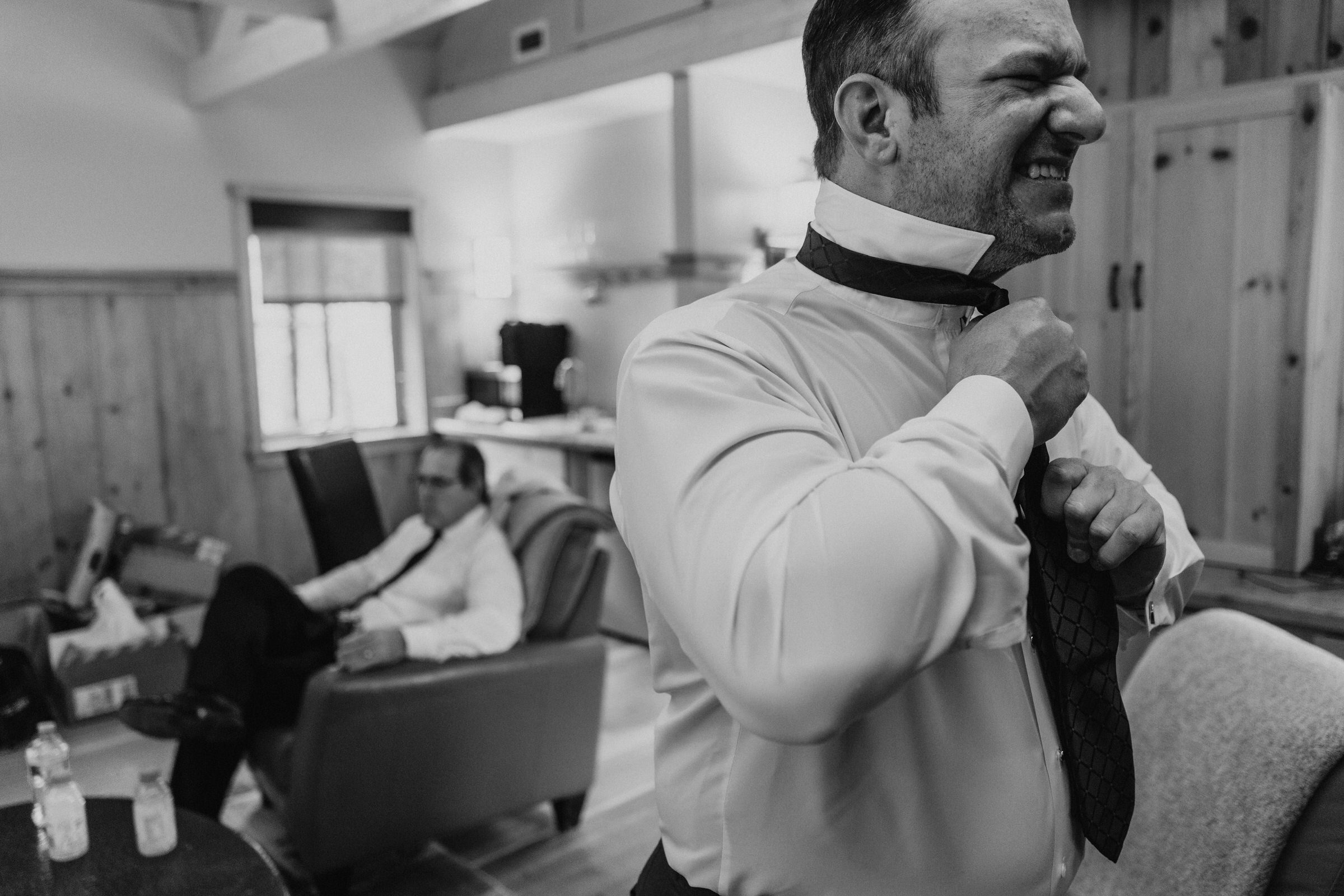 Sleeping Lady Resort weddings: Groom Russ puts his tie on