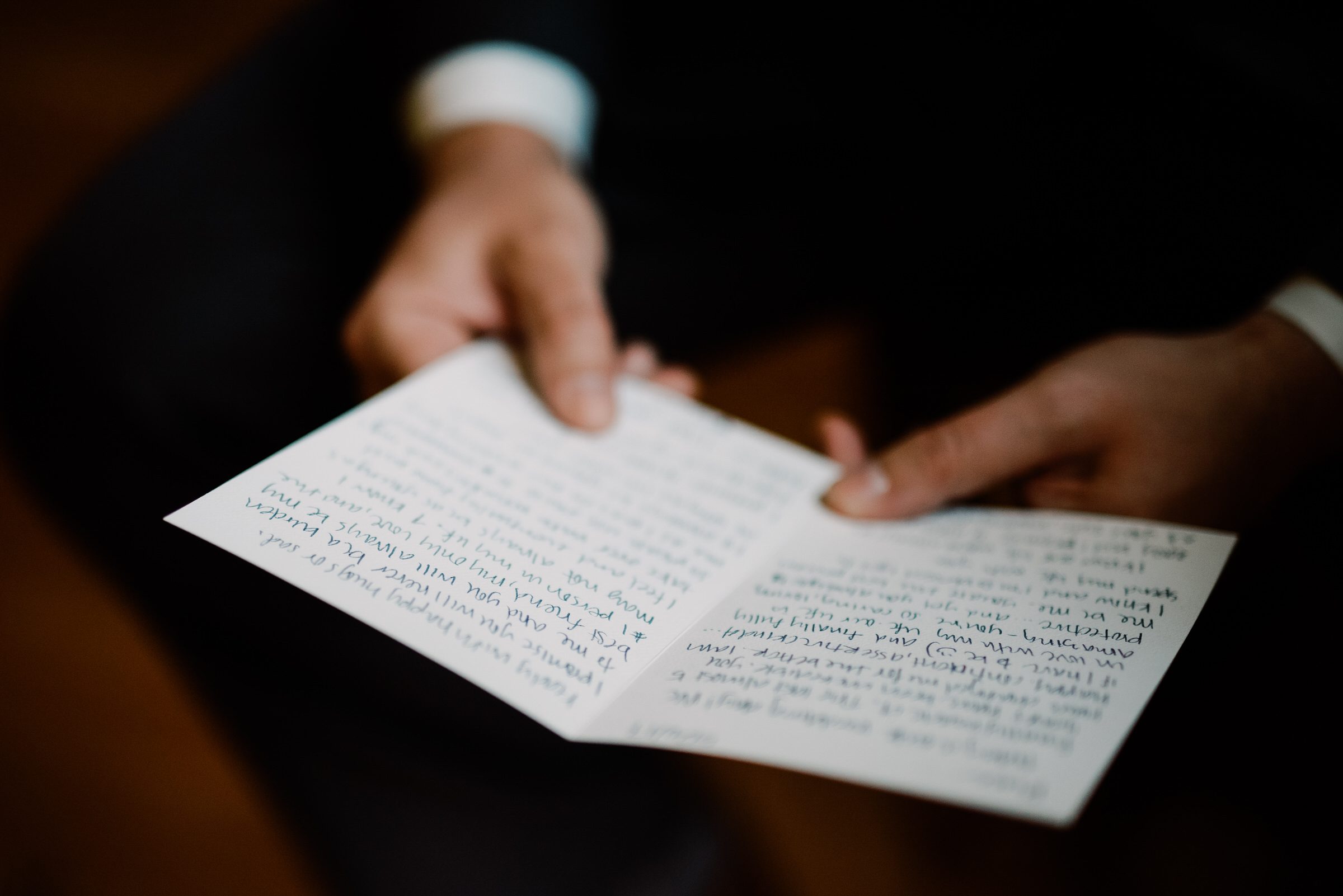 Sleeping Lady Resort weddings: Russ reads a card from Kristen