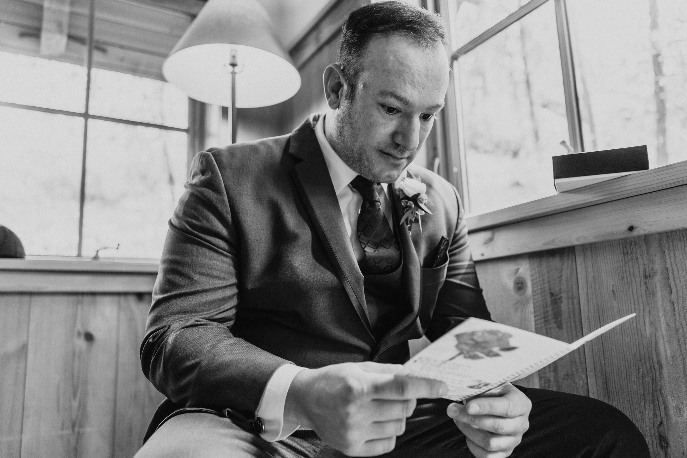 Sleeping Lady Resort weddings: Russ reads a card from Kristen