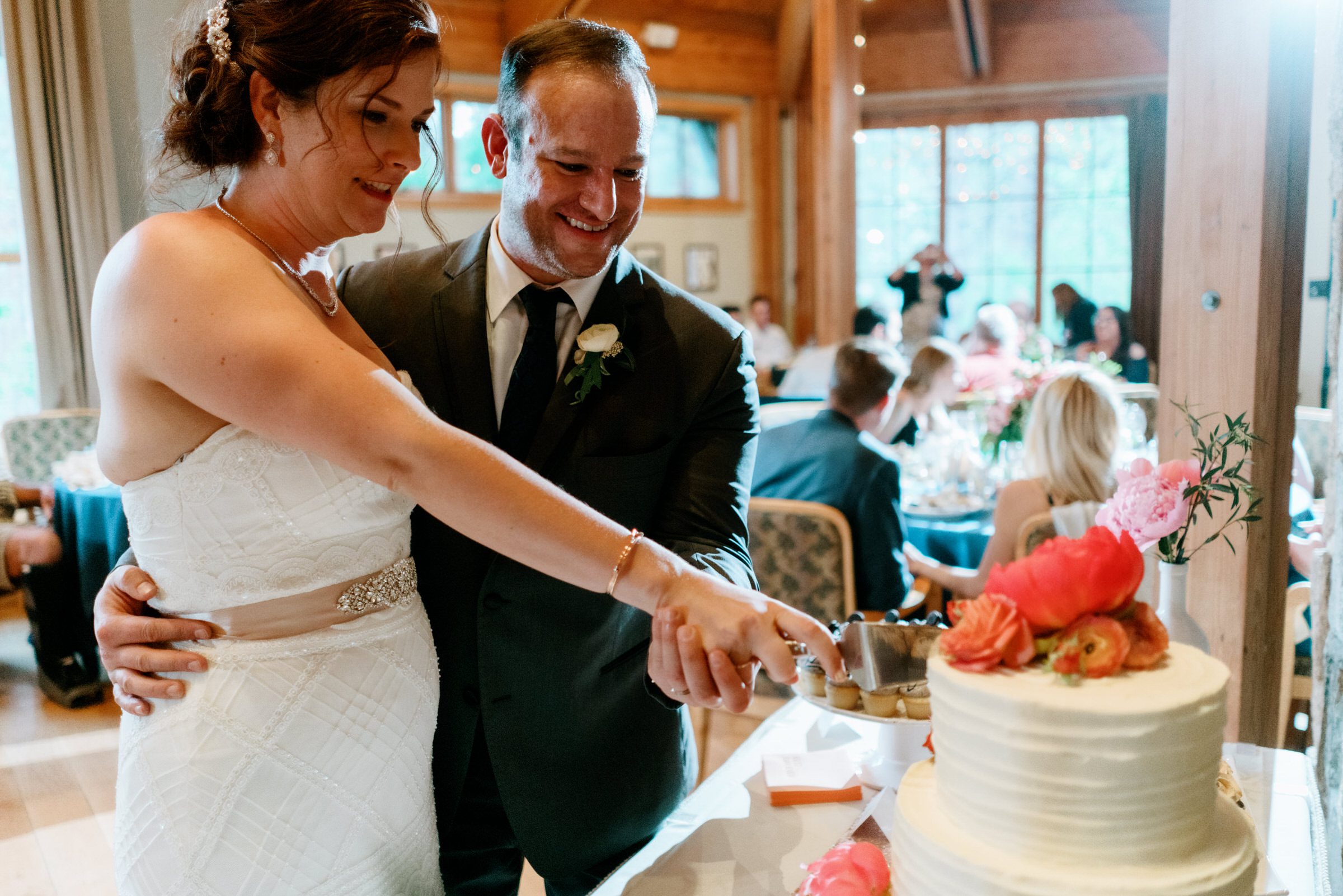 Sleeping Lady Resort weddings: Kristen and Russ cut their wedding cake