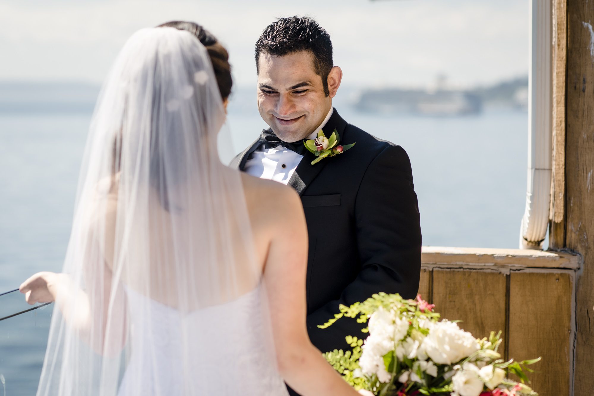 Ash and Kelly's first look at The Edgewater, Seattle. Photo by Jenn Tai, Seattle Wedding Photographer.