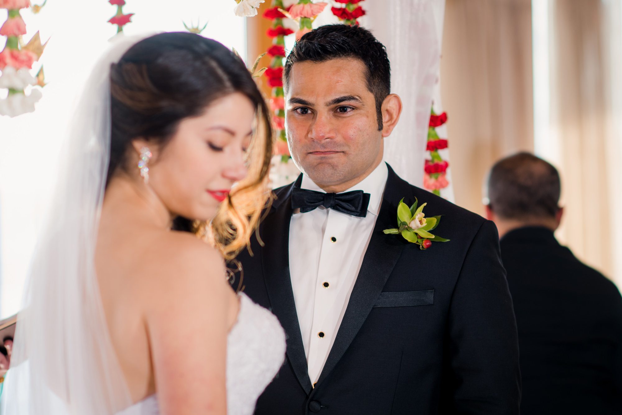 Ash looking at Kelly lovingly during their wedding ceremomy