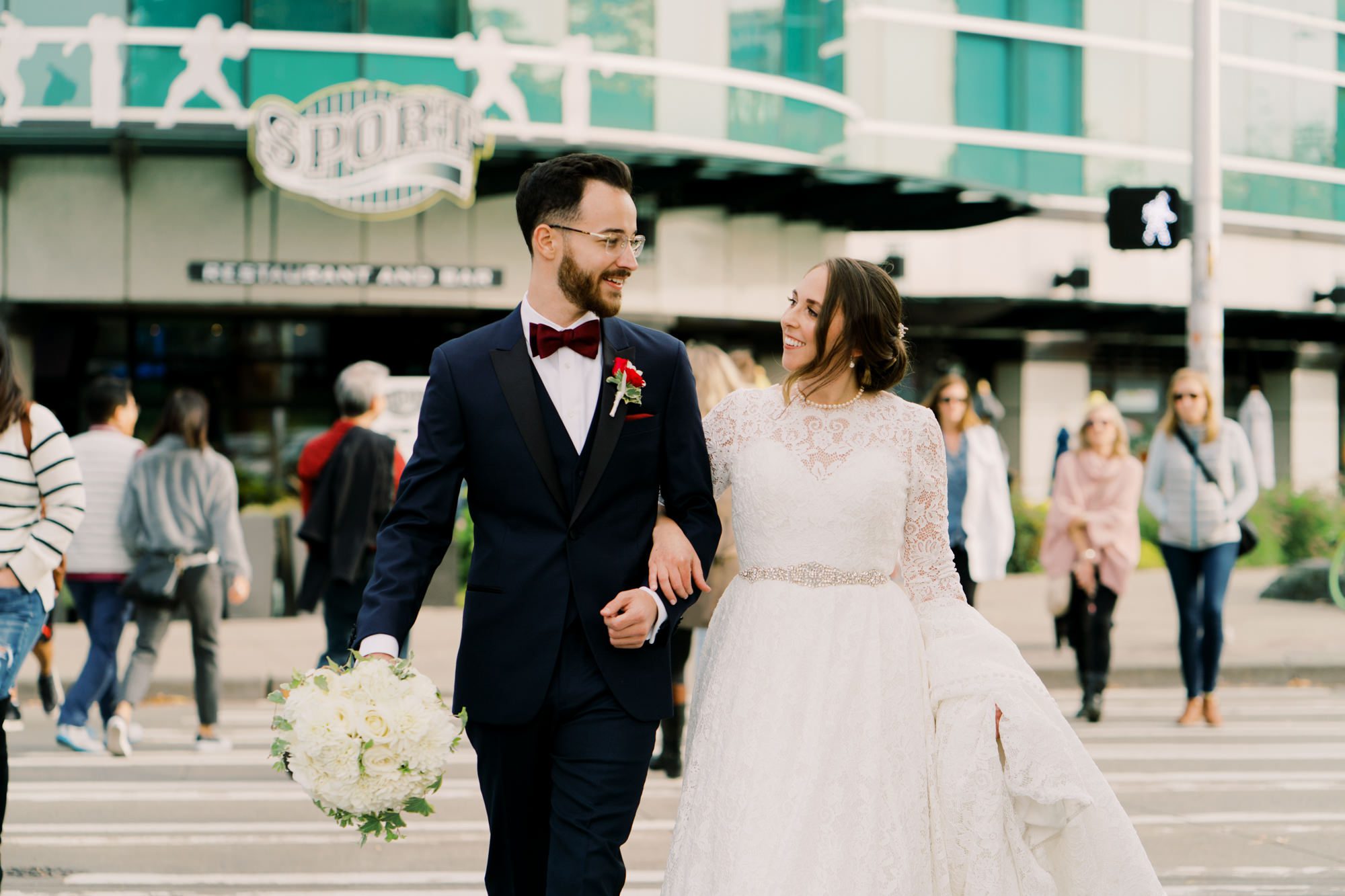 Lauren and Kyle walking across the street to their wedding