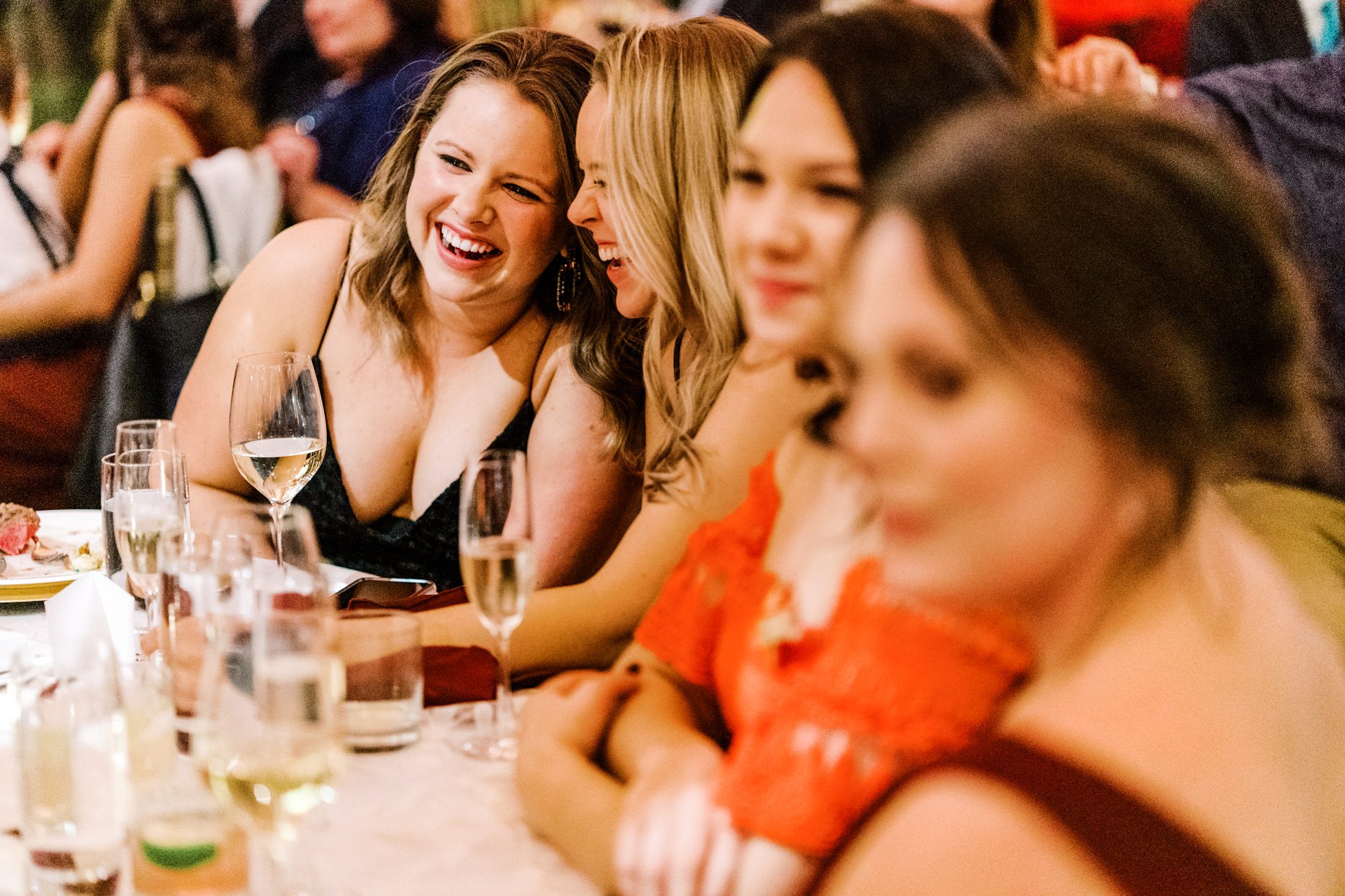Guests laughing at father of the bride toast