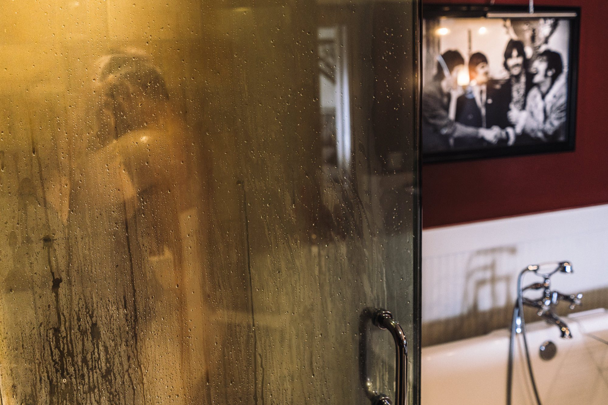 Groom Ash taking a shower before his wedding, photo by Jenn Tai, Seattle wedding photographer