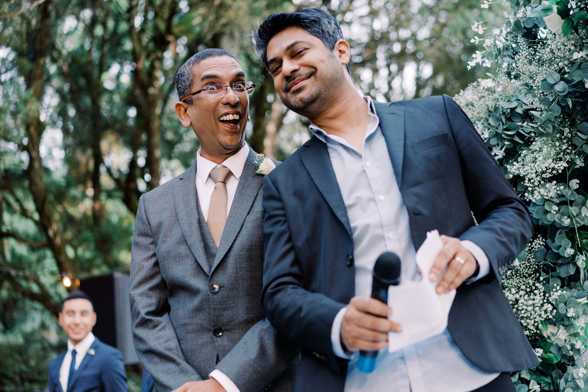 Dhillon and officiant Reuben share a cute moment