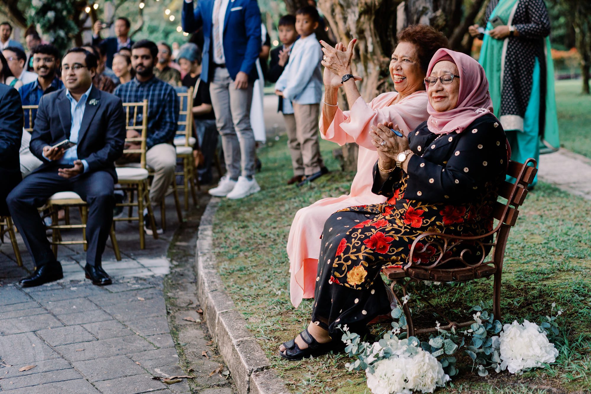 Nadira and Dhillon's moms clap during the wedding ceremony