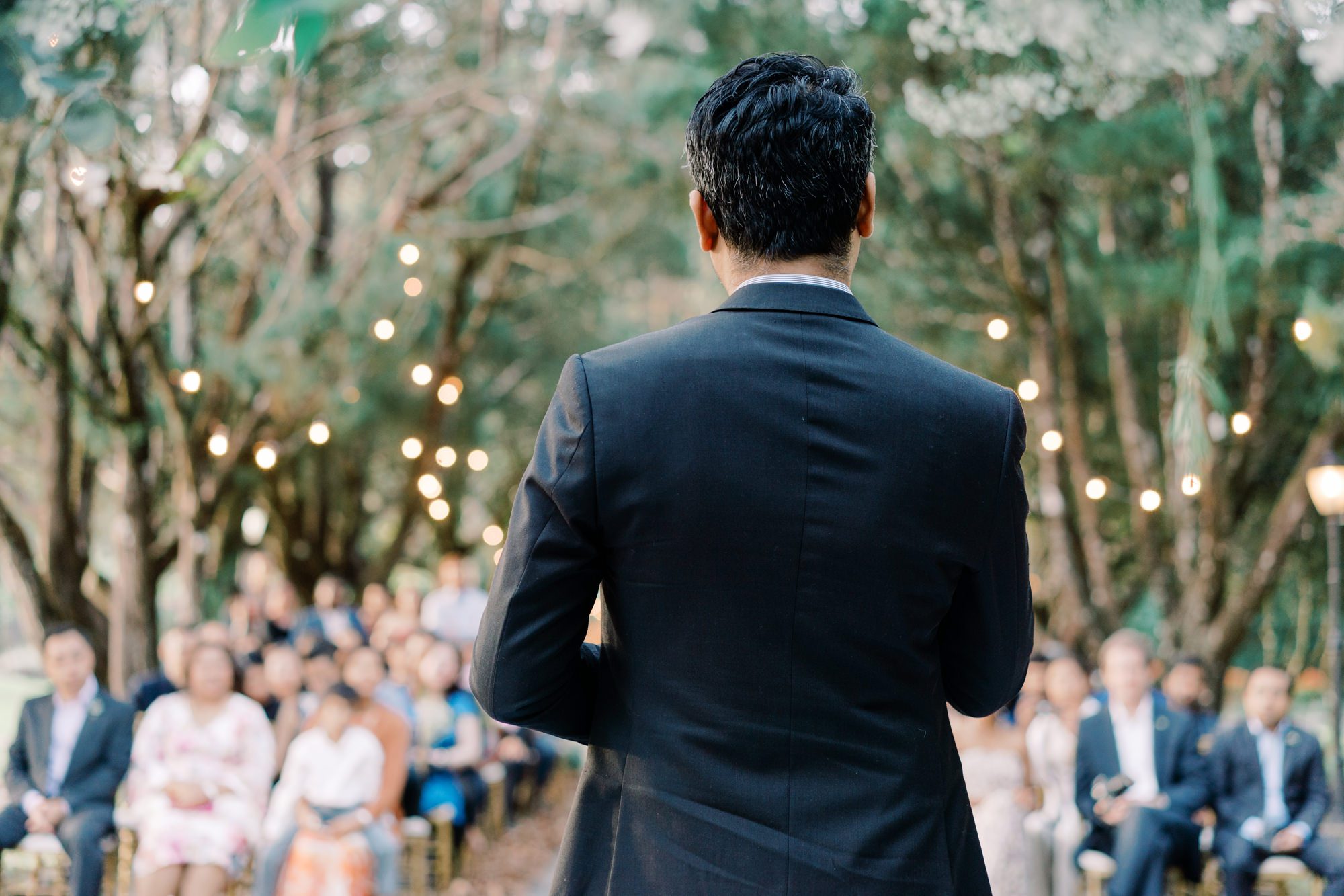 Officiant of Nadira and Dhillon's wedding begins the ceremony at Puncak Dani