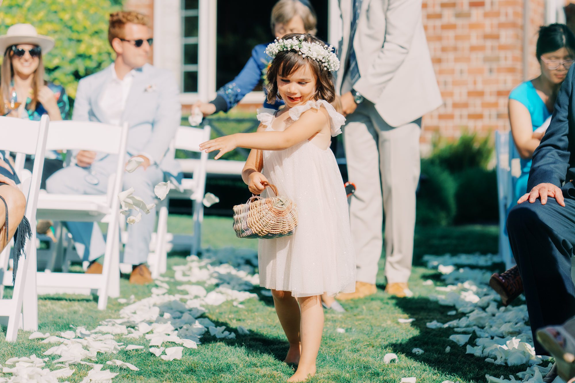 Flower girl doing her job at Jen and Sage's garden wedding