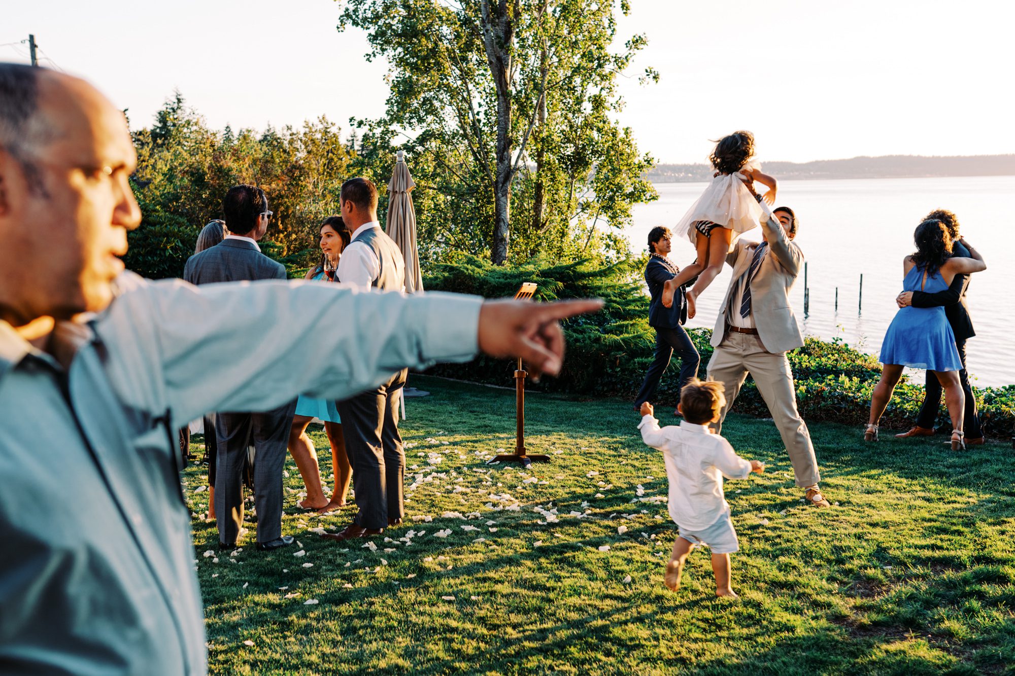 Guests having fun at Jen and Sage's backyard garden wedding.