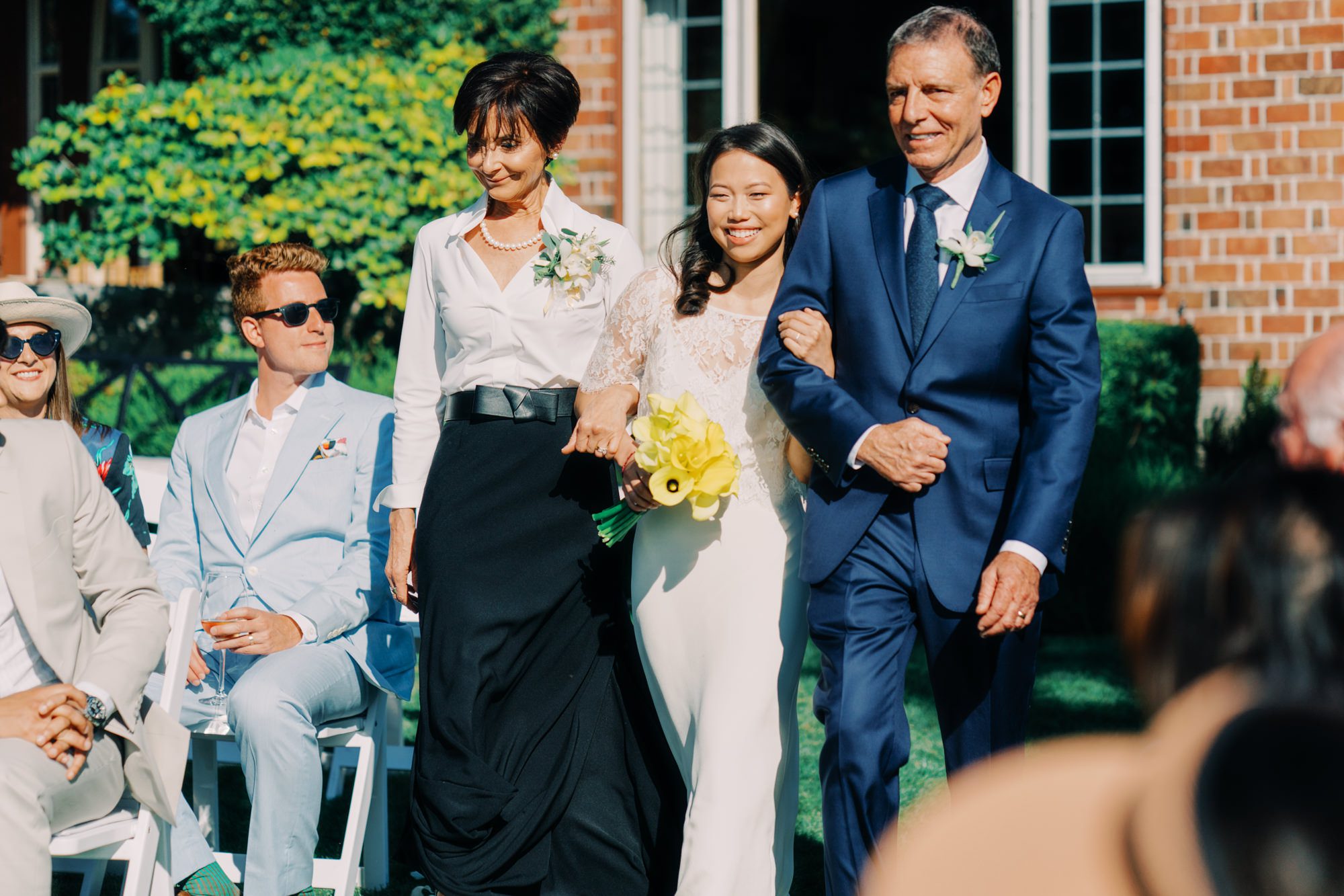 Jen and her parents walk down the aisle