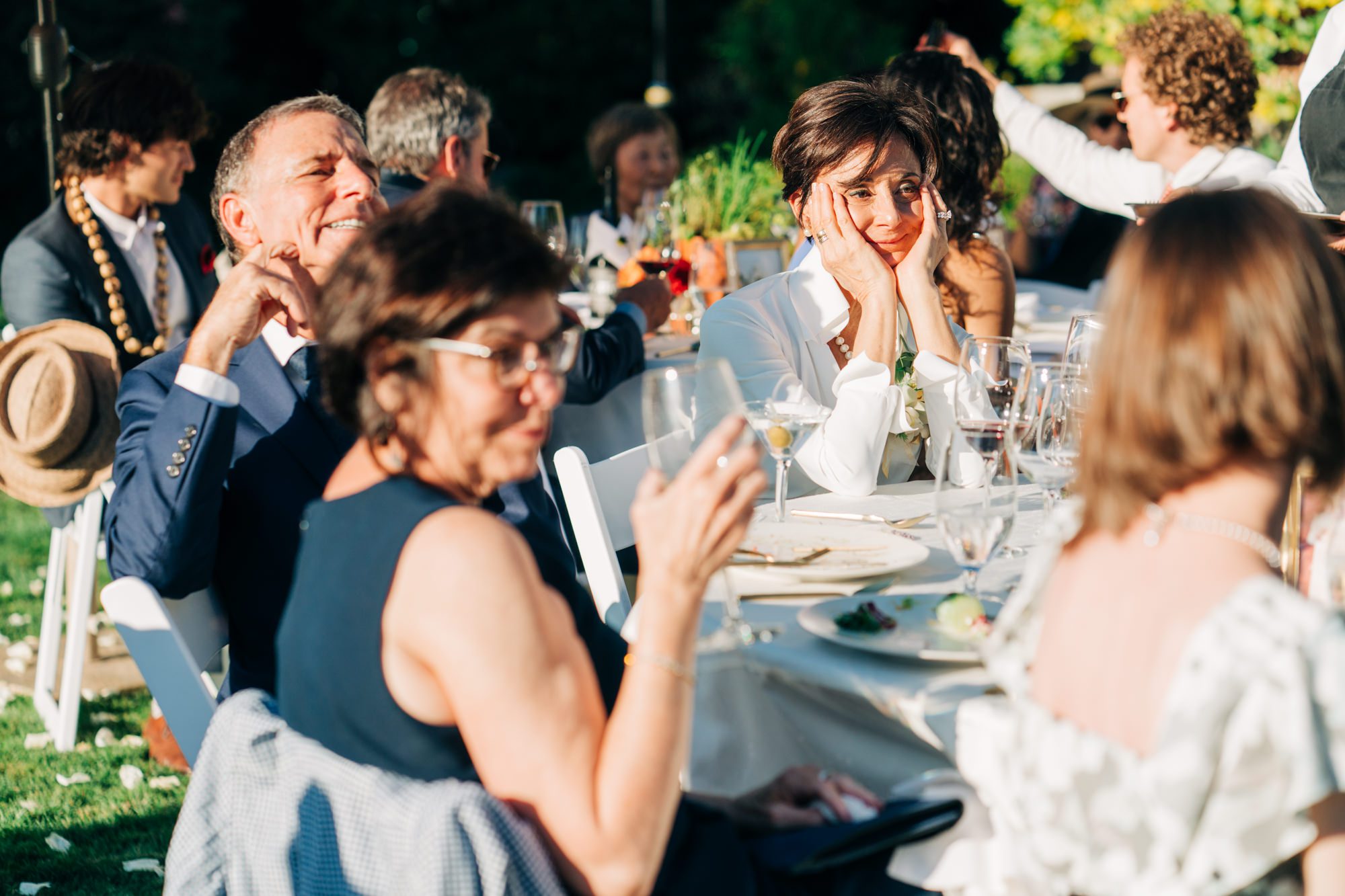 Jen's parents look on during twin's toast