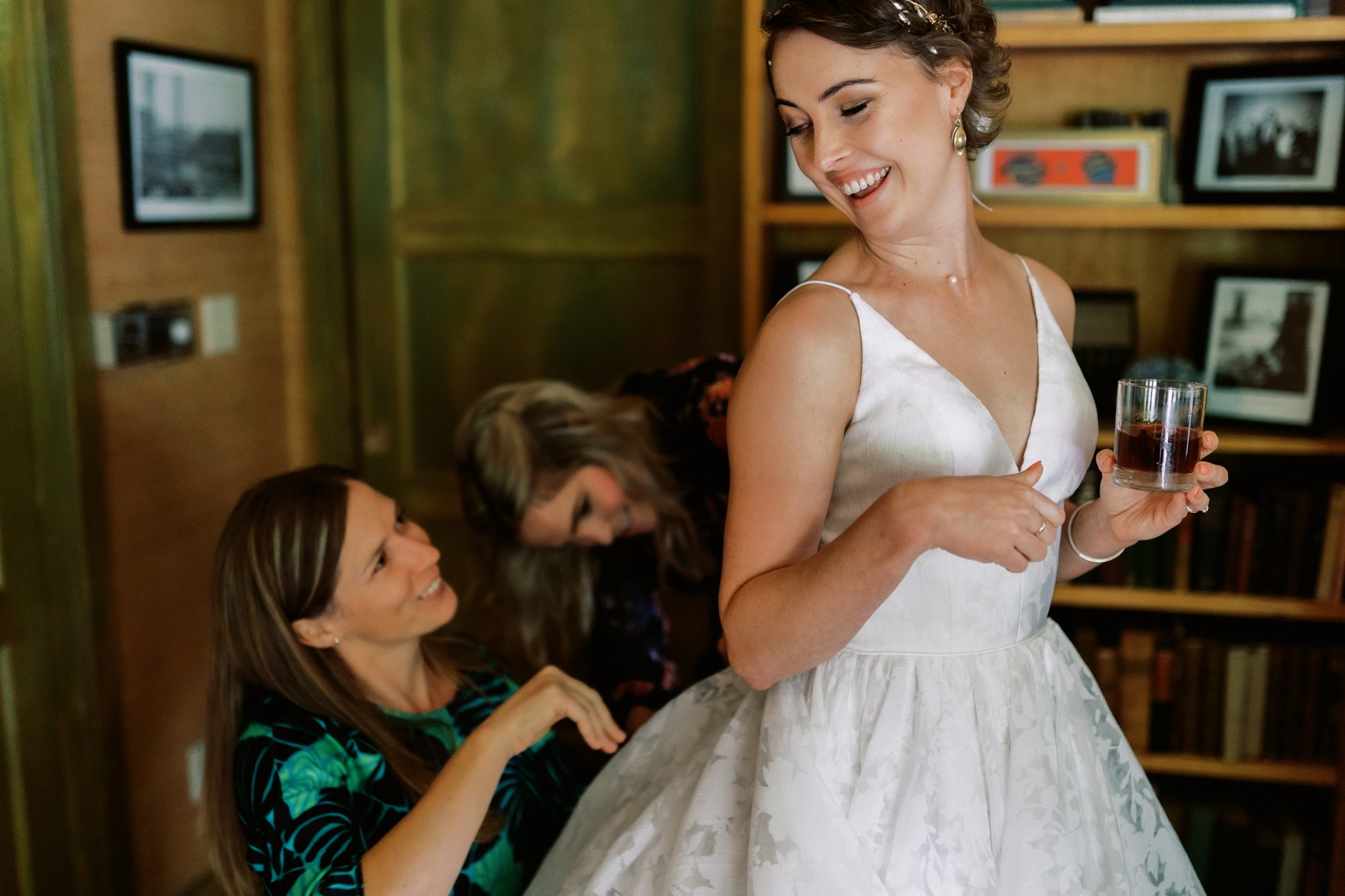 Bride Amy gets her dress bustled