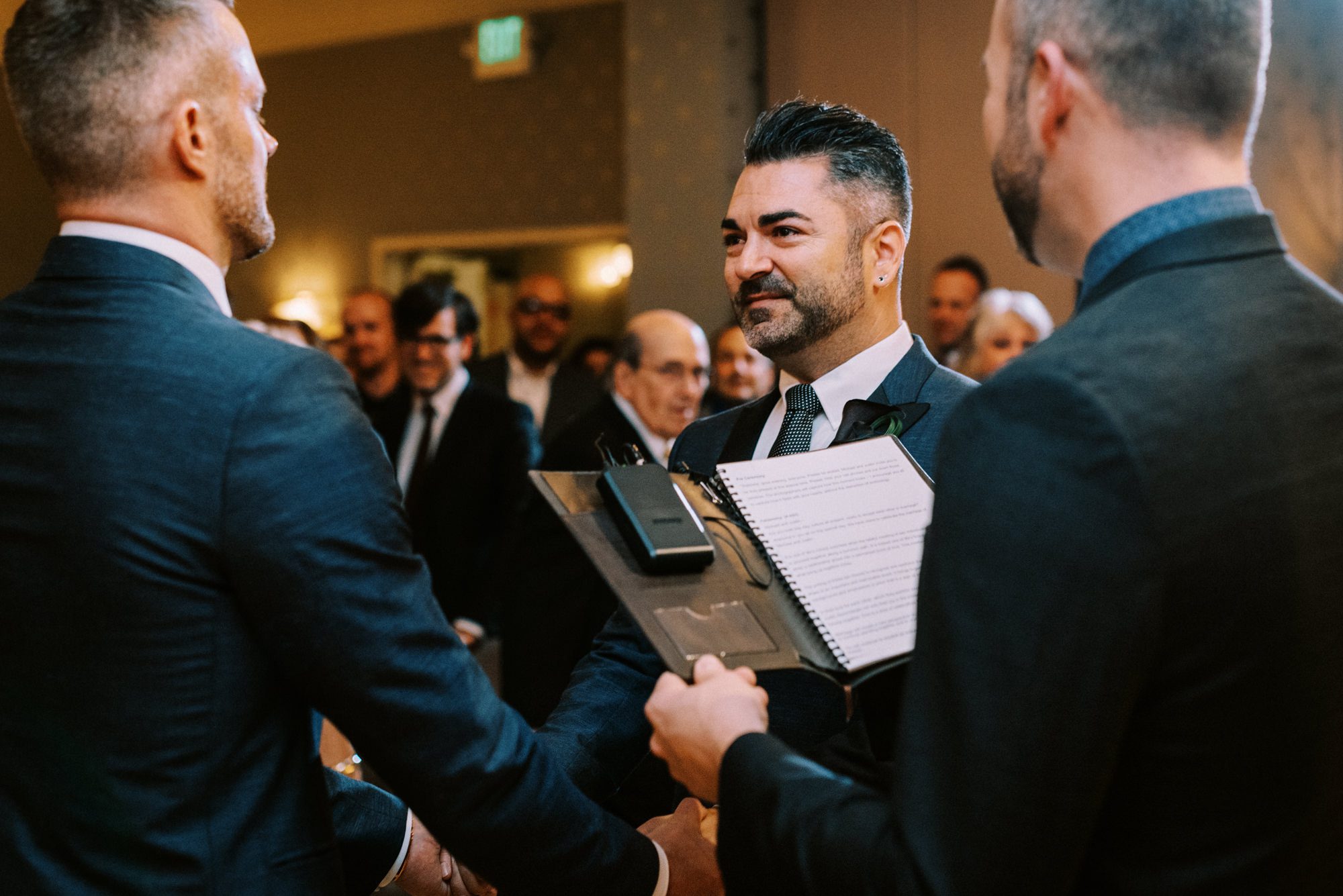 Grooms Michael and Justin at their wedding ceremony at the Alexis Royal Sonesta wedding venue in Seattle Grooms Michael and Justin at their wedding ceremony at the Alexis Royal Sonesta wedding venue in Seattle