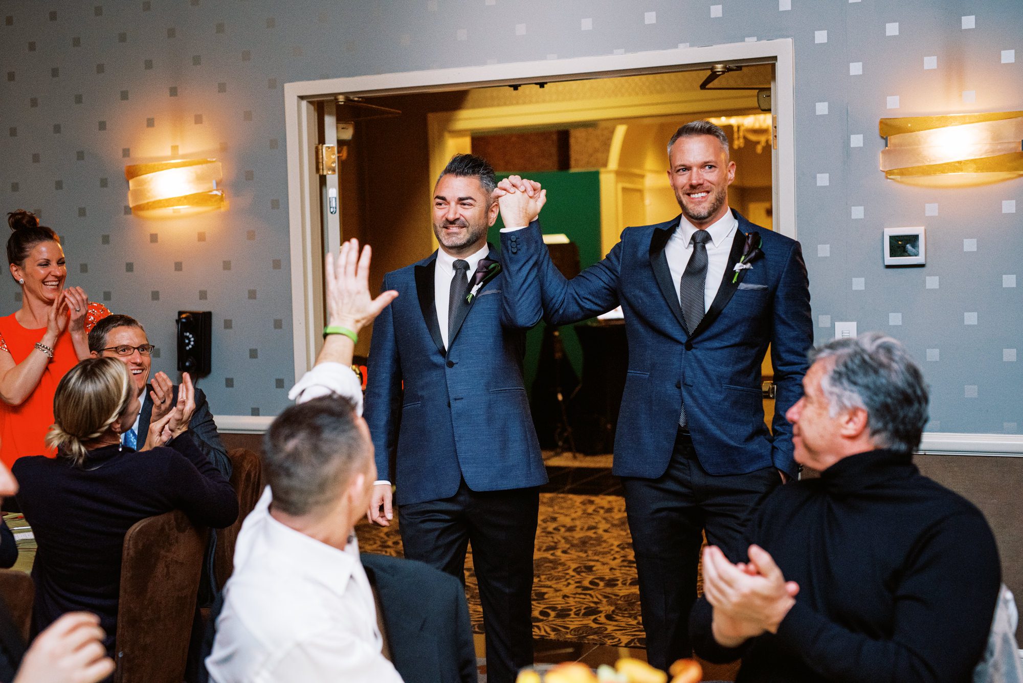 Alexis Royal Sonesta Hotel Hotel wedding: Michael and Justin post wedding reception grand entrance