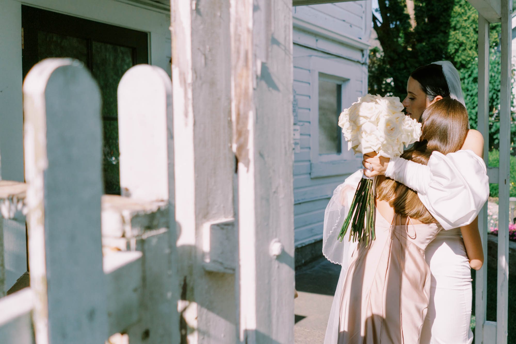 Alexa hugs her bridesmaids