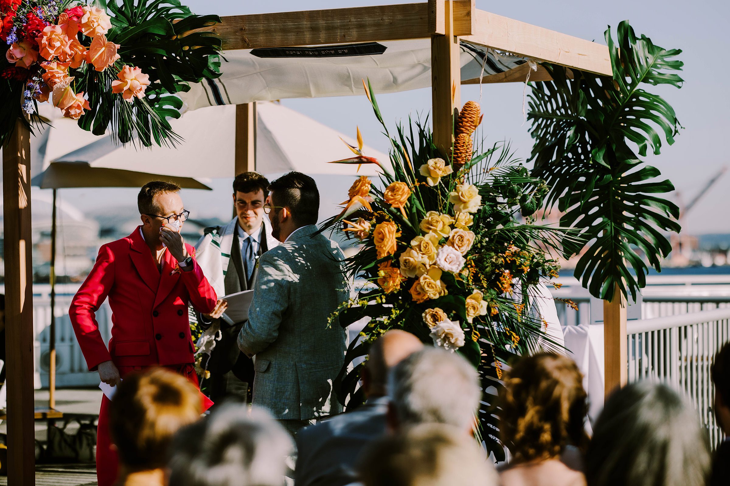 Dustin tears up as he says his vows to Joey at their wedding on the Bell Harbor Conference Center rooftop, summer 2022