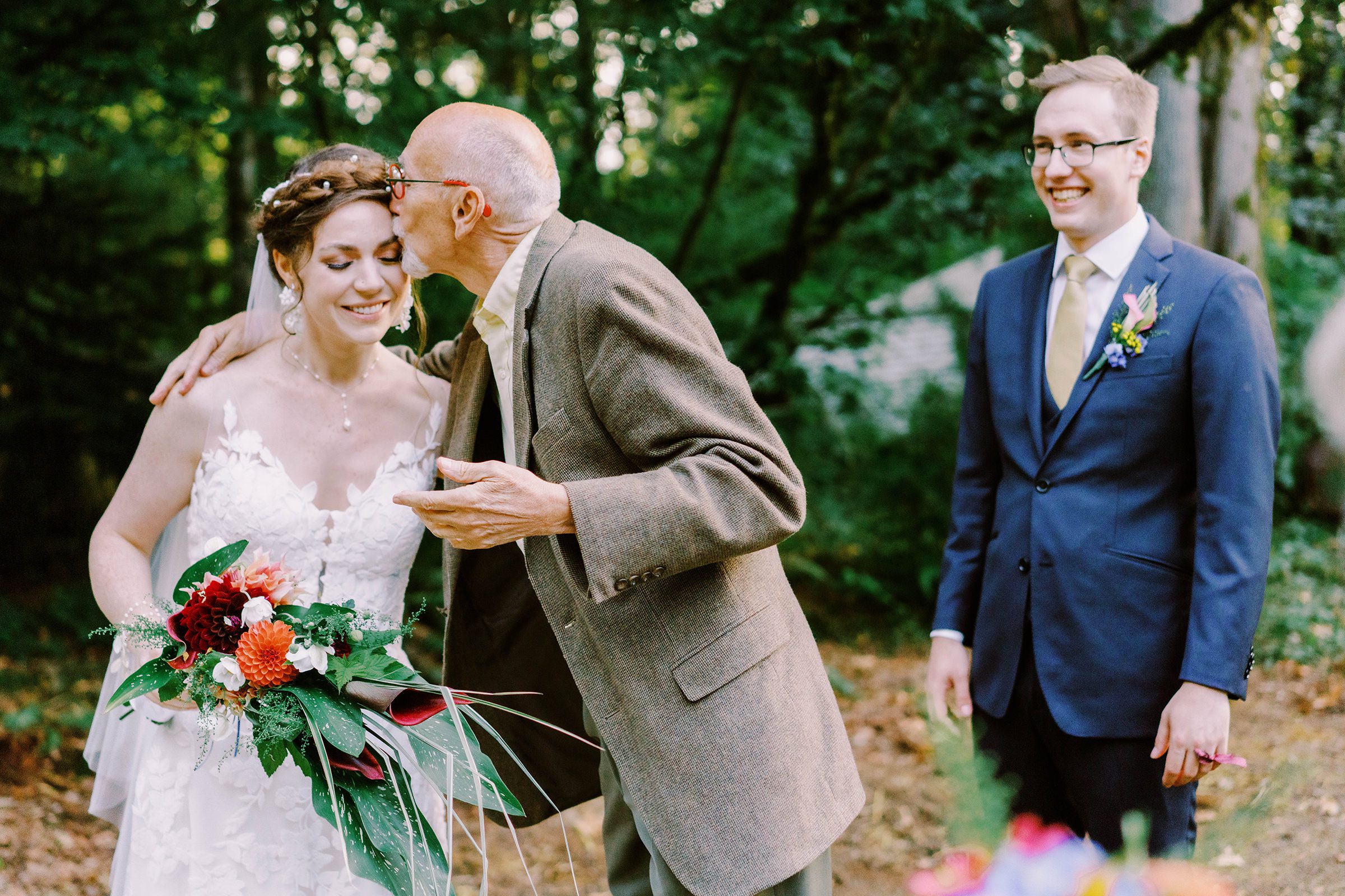 Sean's dad gives Annika a kiss.