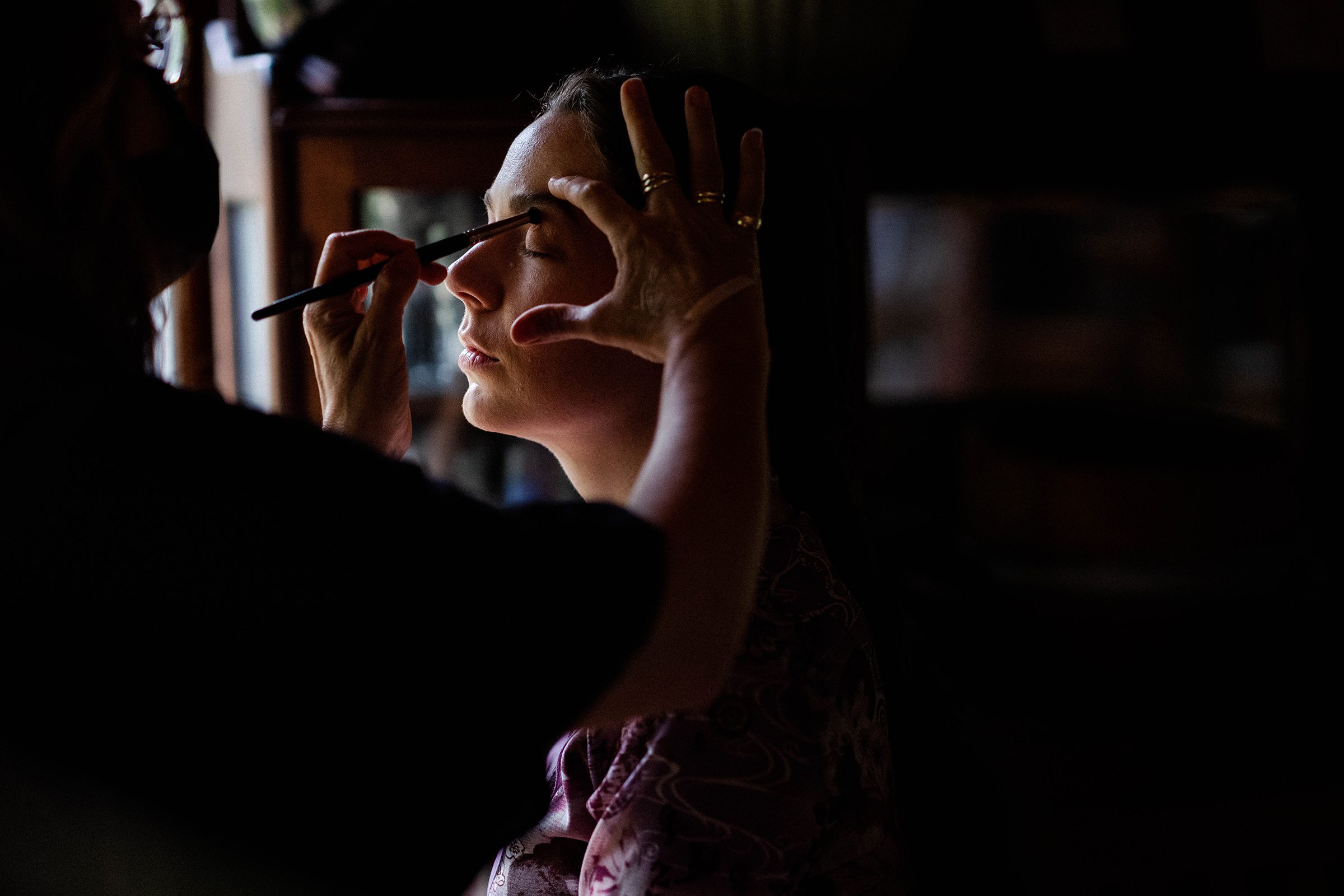 Annika getting her makeup done by her friend