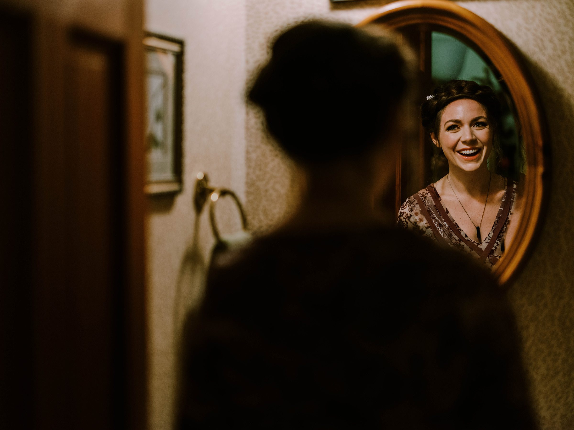 Annika looks at herself in the mirror, getting ready for her wedding